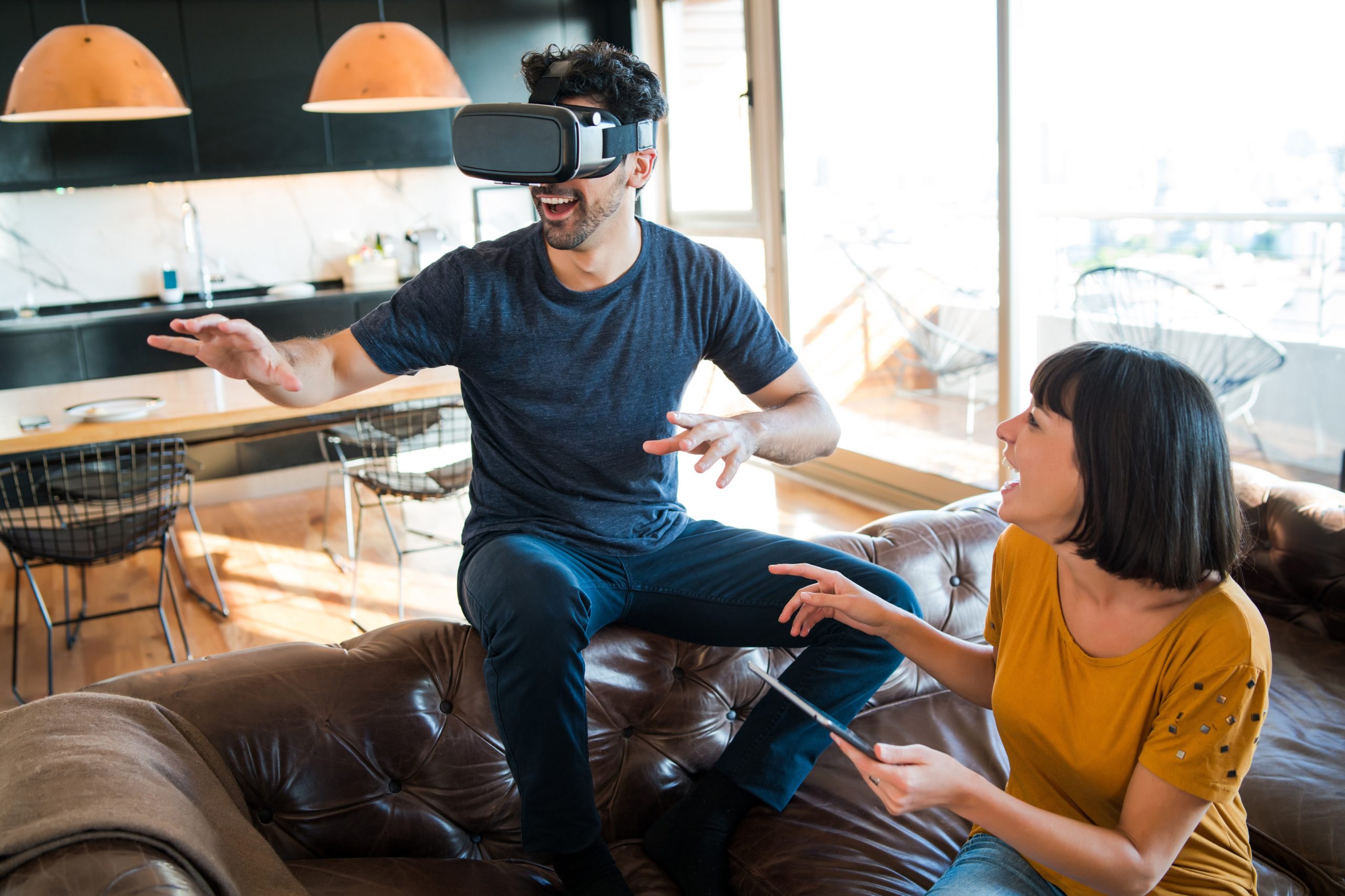 a men and women playing with vr box